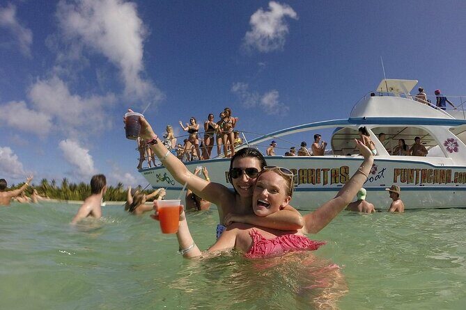 Catamaran party in Punta Cana with open bar, music and more - Stop 1 in Bávaro: Dolphin Viewing From the Boat (Short but Memorable)