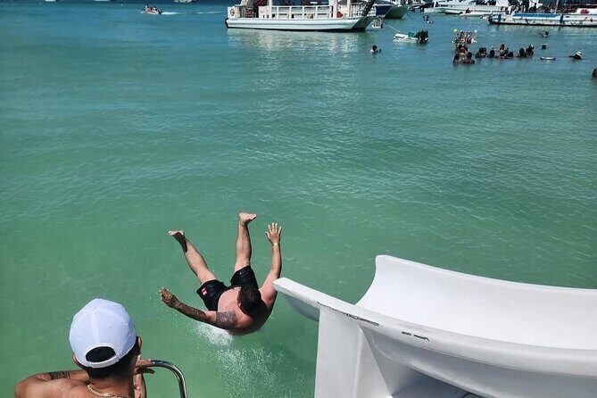 Catamaran party in Punta Cana with open bar, music and more - The Open Bar Setup: Dominican Rum, Soft Drinks, and Fruit