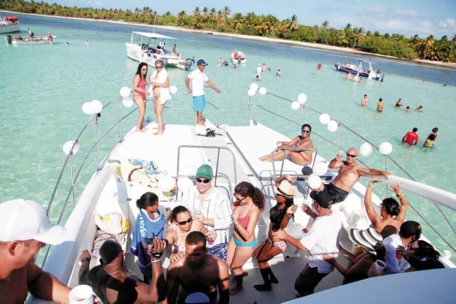 From Bavaro, Punta Cana: Boat Party, Snorkeling, Drinks, Snacks, and Transportation - Dolphin spotting: a quick look in their habitat