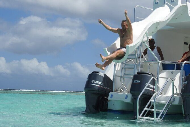 Full-Day Tour Isla Bonita Deluxe - Catamaran THE OCEAN KING DELUXE: solarium, slide, and comfort