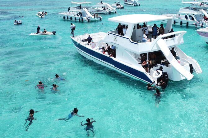 Punta Cana Shared Party Boat Booze Cruise and Snorkeling - Stop 1 at Bavaro Reef: Gear, Guide, and Fish-Spotting